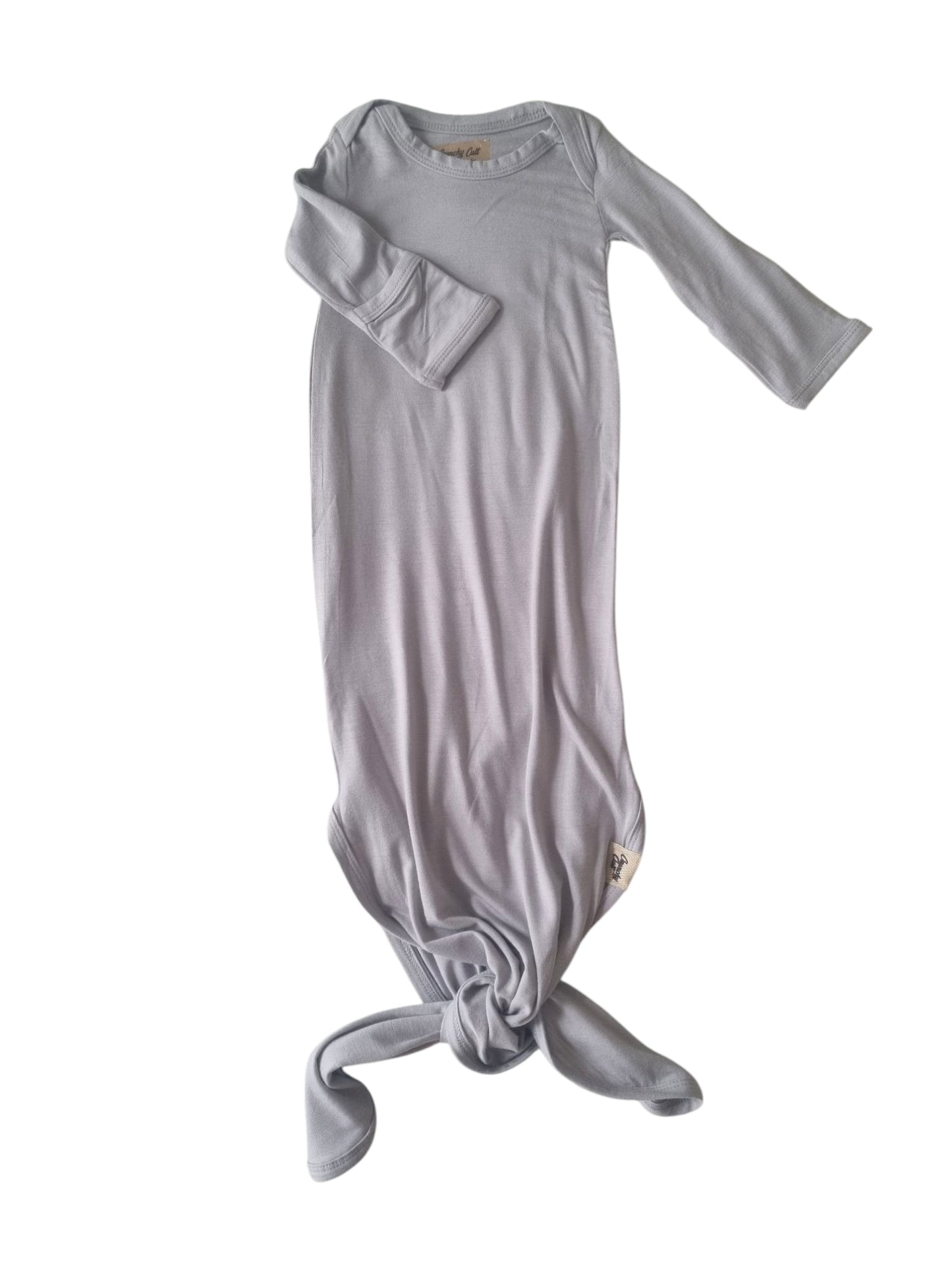 Grey Baby knotted gown, one sleeve pointing out to the right and on sleeve showing rolled sleeve, front view