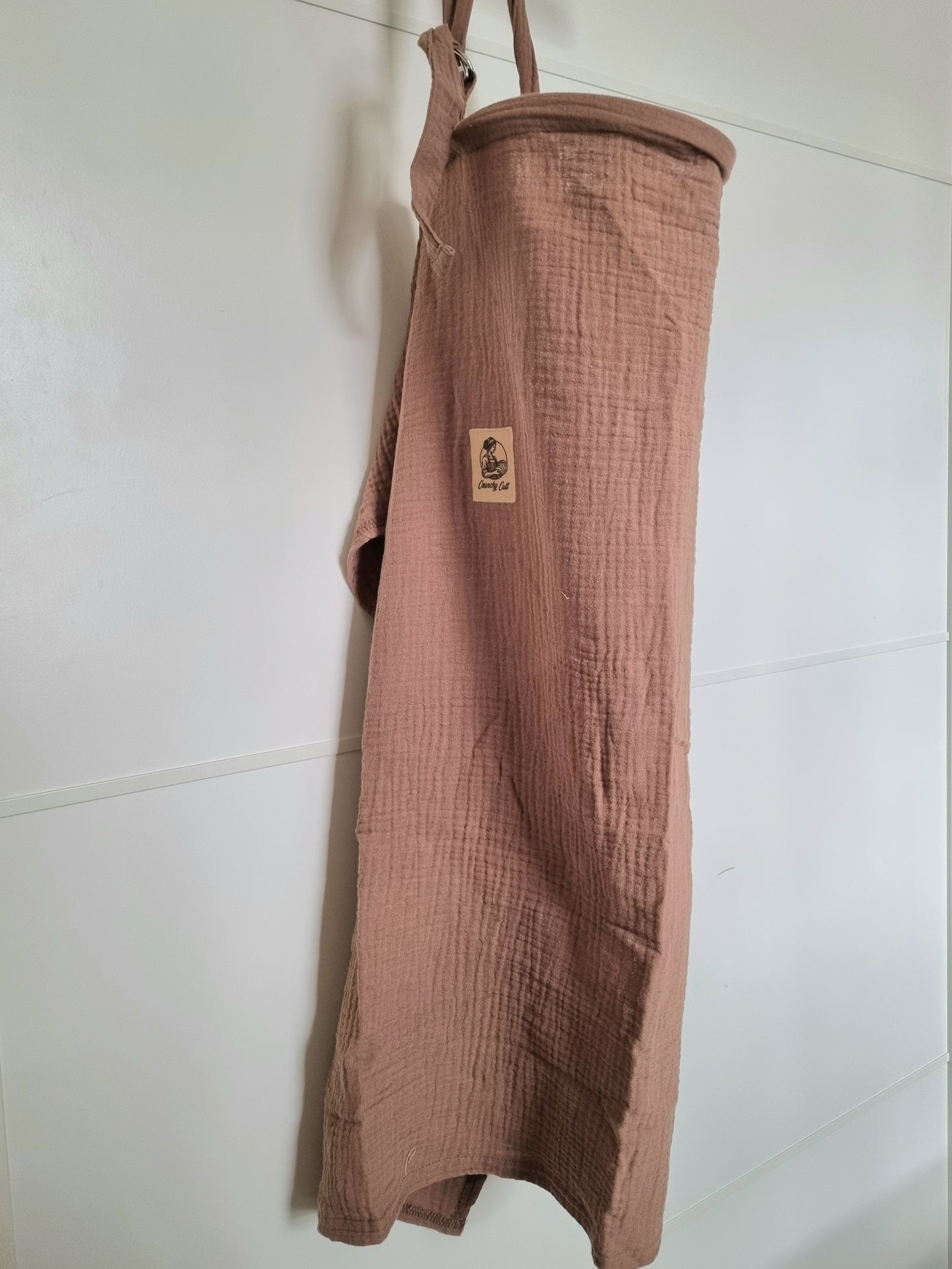 Brown breastfeeding cover, hanging, showing full cover, side view