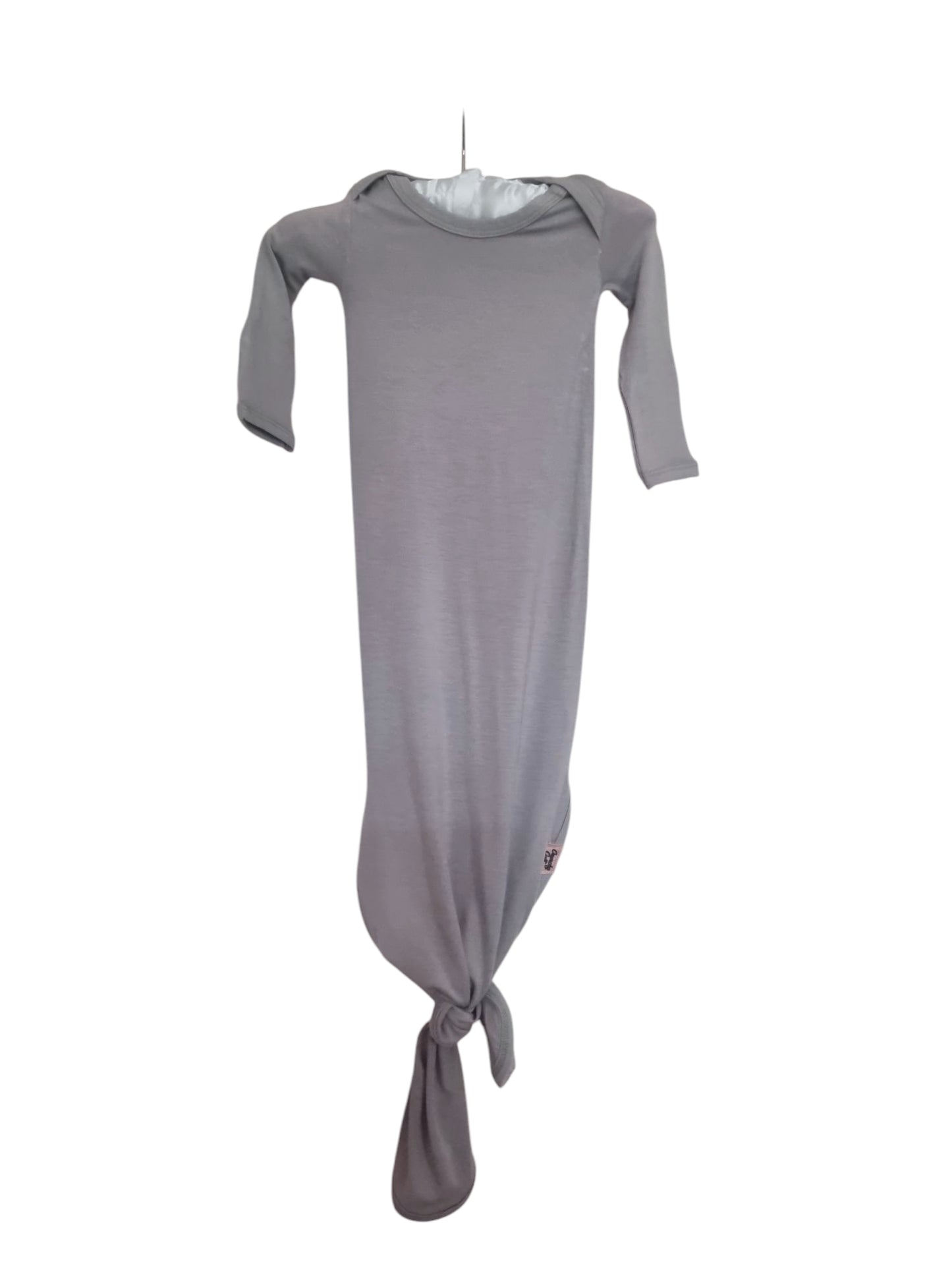 Grey knotted baby gown on hanger and white background, front view