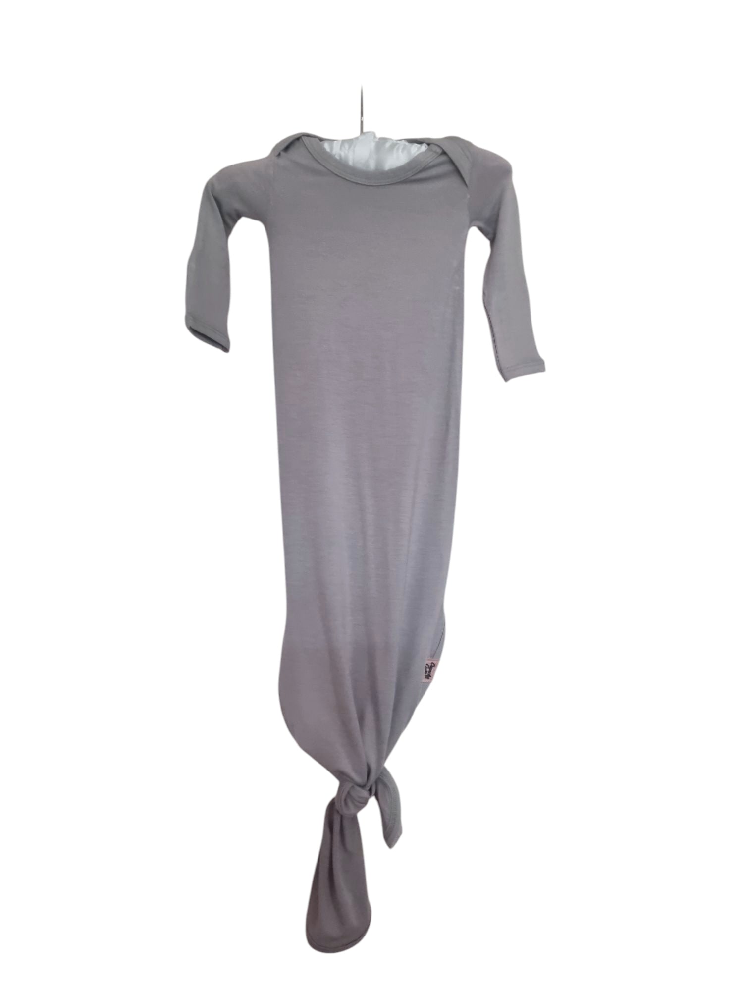 Grey knotted baby gown on hanger and white background, front view