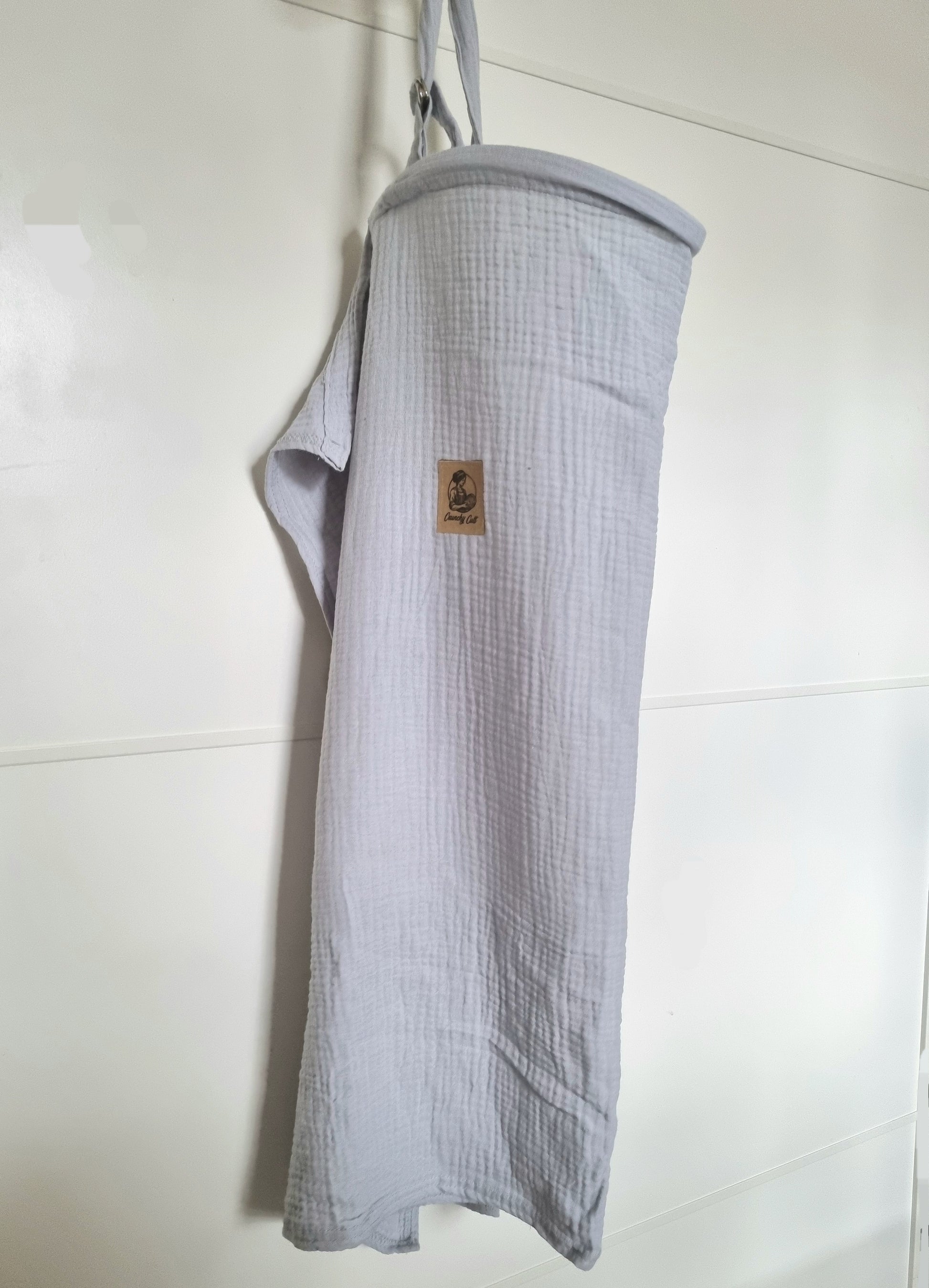 Grey breastfeeding cover, hanging, showing full cover, side view